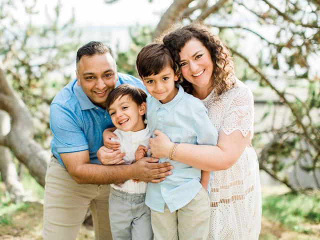 Sara Milles Gupta with her husband and two children