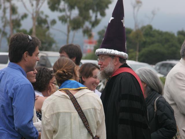 Professor Tiffney talking with students after Commencement in 2013