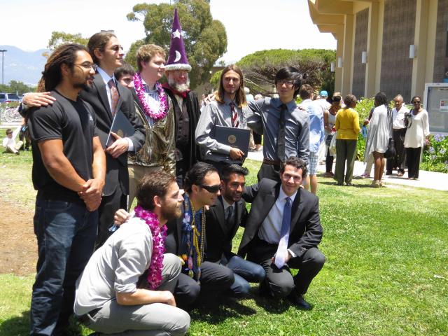 Professor Tiffney posing with students after Commencement in 2015