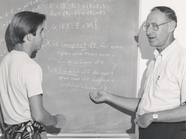 Professor Max Weiss with a student